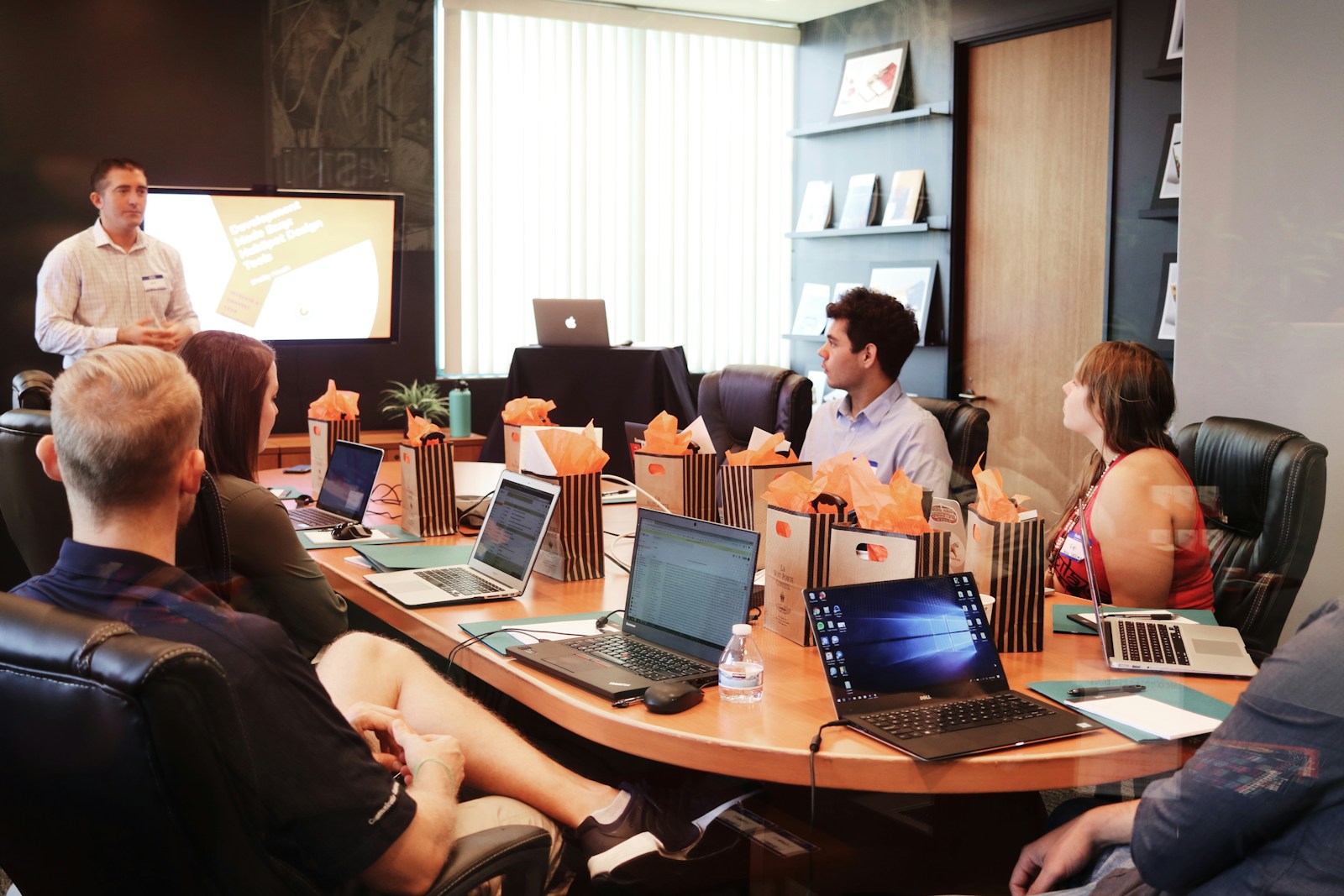 Business meeting with presentation on screen